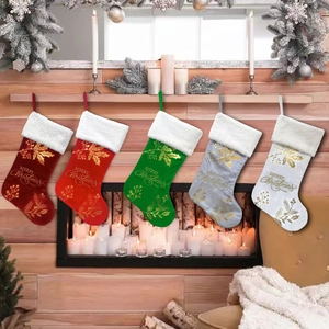 Five velvet Christmas stockings with faux fur trim hanging on a fireplace mantel