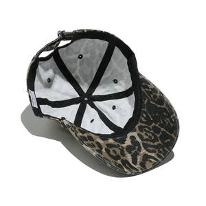 Detailed interior of 100% cotton leopard baseball cap with sweatband and care label