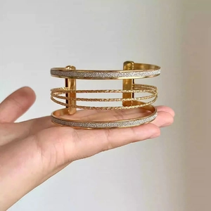 Minimalist gold multi-layer open cuff bracelet with frosted texture and twisted rope design