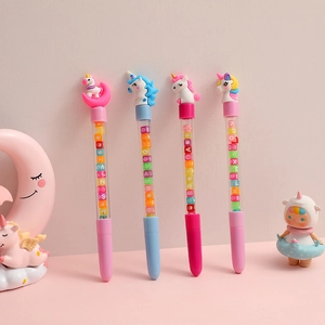 Set of four cute unicorn pens with transparent barrels and colorful letter beads