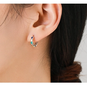 Close-up of S925 sterling silver C-shaped hoop earrings with colorful enamel hearts