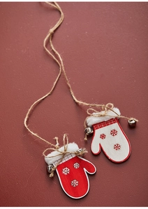 Detail of red wooden glove Christmas ornament with jute rope, white fur, and small bell