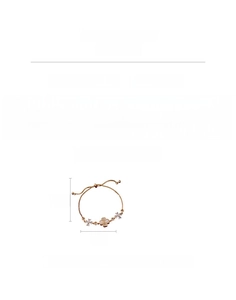 Detail of adjustable clover bracelet with cat eye stone and cubic zirconia inlay
