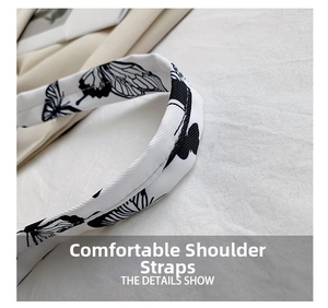 Detail of comfortable fabric shoulder strap with elegant black butterfly print patterns