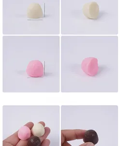 Detailansicht der 2cm Miniatur-Schokoladenkuppeln in Weiß, Rosa und Braun Tönen