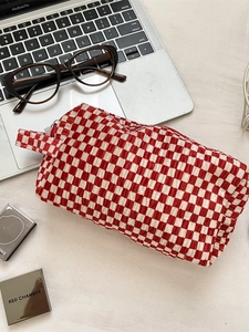 Red and white checkered velvet makeup bag with textured bubble fabric and handle