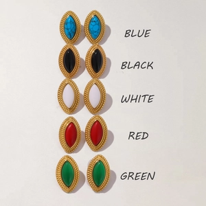 Detail view of oval titanium steel earrings in five gemstone colors with gold plating