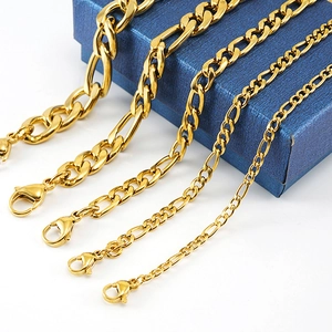Detail view of 18K gold plated Figaro chains in four different widths on a blue box