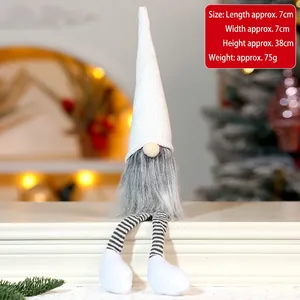 Close-up of a long-legged Christmas gnome decoration, 38cm tall sitting on white steps