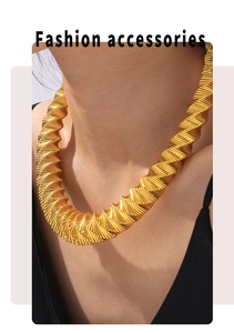 Detailed view of chic gold chunky collar necklace with unique spiral textured design