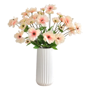 Faux silk butterfly ranunculus and poppy arrangement in white ceramic ribbed vase
