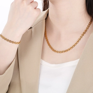 Golden 5mm hollow square grid necklace and bracelet set on fashion model neck
