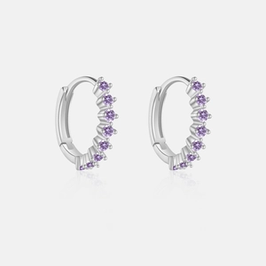 Macro view of S925 sterling silver hoop earrings set with nine purple zircons