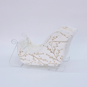 Christmas sleigh decor with white plush fabric and gold leaf print on metal frame