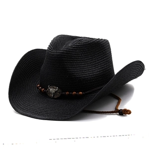 Black western straw cowboy hat featuring metal bull head buckle and adjustable chin strap