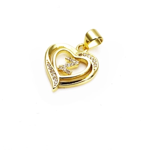 Detailed close-up of a gold heart pendant with crystal-inlaid letter N on white background
