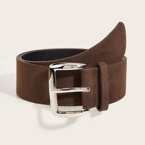 Vintage dark brown suede wide belt with silver pin buckle on a minimalist cream background