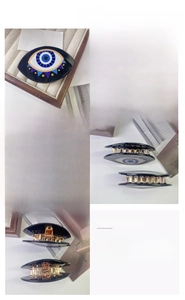 Detailed views of acetate evil eye hair claw clip with golden metal spring and teeth