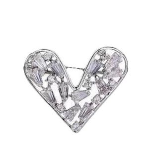 Mini silver heart brooch for women featuring hollow design and sparkling zircon stones
