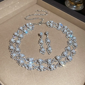 Exquisite pearl and crystal jewelry set displayed in a premium beige gift box