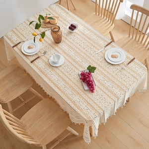 Elegant beige lace tablecloth with vintage crochet patterns and decorative tassels