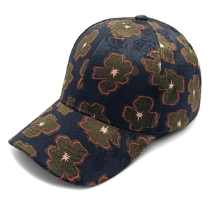 Navy blue baseball cap with green floral prints and red outlines for women