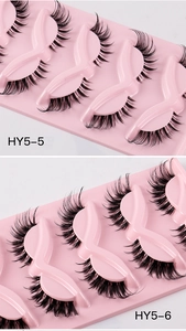Macro detail of thick curled false eyelashes on pink tray models HY5-5 and HY5-6