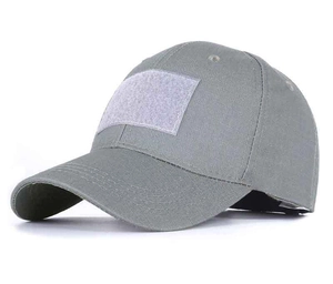 Close-up of tactical camouflage cap featuring a large velcro patch panel and durable fabric