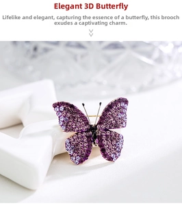 Macro detail of the purple rhinestone butterfly brooch with golden metal plating