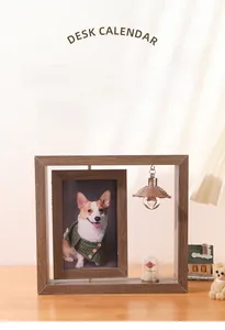Detail of creative rotating double-sided wooden photo frame with micro landscape and warm light