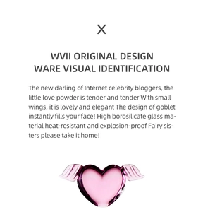 Detail of pink heart-shaped glass with wings made of heat-resistant borosilicate glass