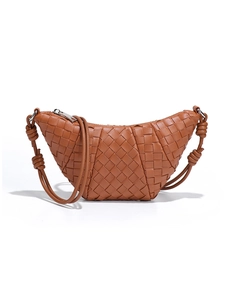 Handwoven caramel croissant bag with knotted handle and premium leather texture