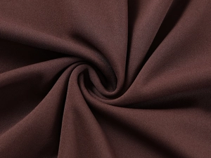 Close-up of high-quality brown skin-friendly stretch fabric with smooth texture and silk feel