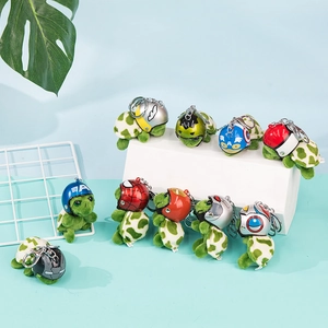 Macro shot of assorted mini plush turtles with superhero themed helmets and keychains
