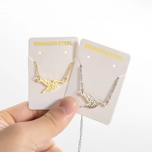 Minimalist stainless steel hummingbird pendant necklaces in gold and silver finishes