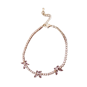 Elegant gold bracelet with sparkling white zircons and pink purple butterfly charms
