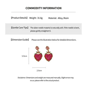 Detail of pink glitter heart earrings with rose accents and product dimensions