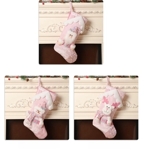 Pink velvet Christmas stockings with sequined 3D Santa, Snowman, and Reindeer dolls