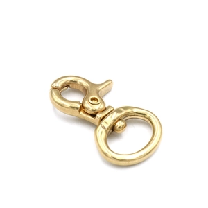 Detailed view of polished solid brass swivel snap hook for leather craft hardware