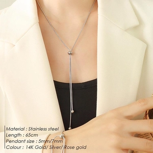 Detail of a 65cm stainless steel snake chain necklace and bracelet on a fashion model