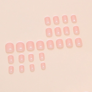 Short minimalist French press-on nails in nude pink and white tip glossy finish