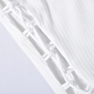 Macro detail of the white ribbed knit fabric with adjustable lace-up drawstring design