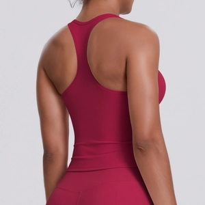 Detail of burgundy racerback sports vest showing moisture-wicking fabric and elastic fit