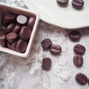 Macro view of 15mm resin coffee bean models for DIY phone case making accessories