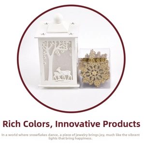 Detail view of white lantern with deer silhouette and gold glitter snowflake decor