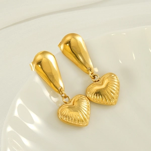 Polished gold titanium steel heart drop earrings with textured sunburst pattern finish