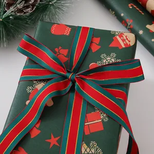 Detail of Christmas gift box with green deer pattern and red-gold striped ribbon bow