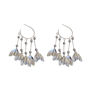 Silver hoop earrings with long metallic fringe, leaf pendants and faux pearl accents
