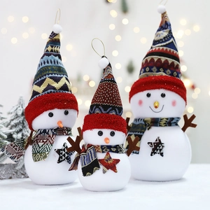 Three plush Christmas snowmen with patterned hats and scarves for festive holiday decoration