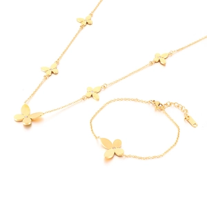 Elegant gold stainless steel clover jewelry set featuring a necklace and bracelet set